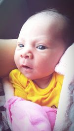 Portrait of cute baby girl at home