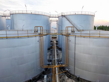 Metallic structure in factory against sky. tank oil industry factory