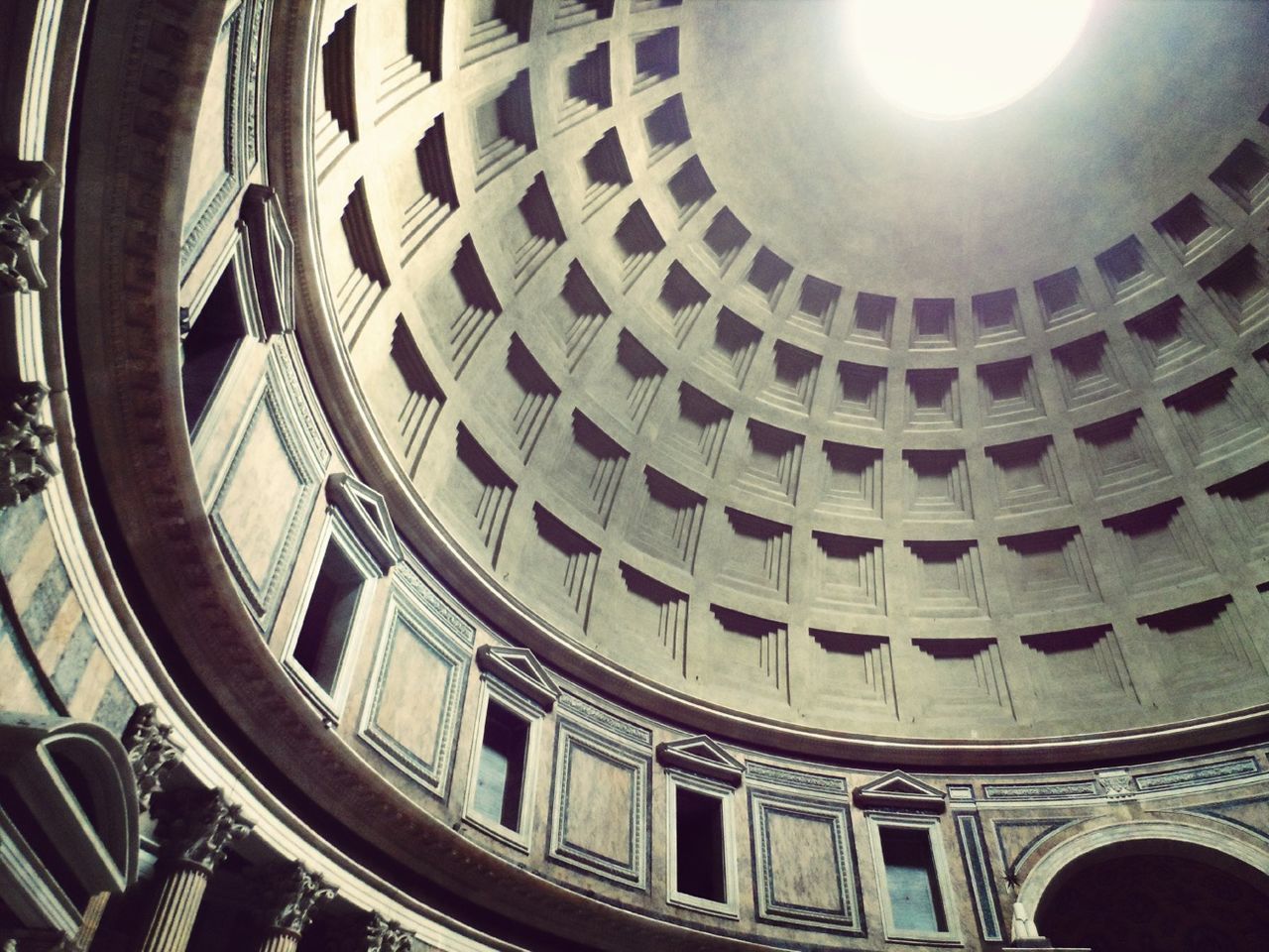 indoors, architecture, ceiling, built structure, low angle view, architectural feature, interior, circle, history, pattern, famous place, illuminated, repetition, arch, place of worship, design, ornate, directly below, dome, religion