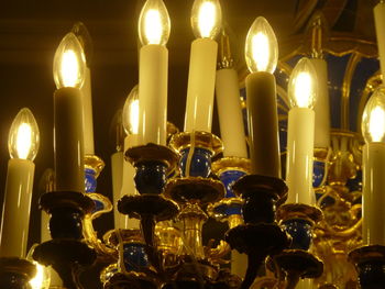 Low angle view of illuminated candles in temple
