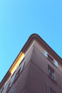 Low angle view of building against clear blue sky