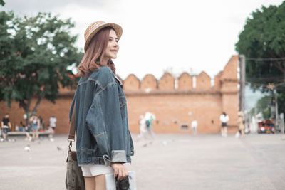 Woman standing in city