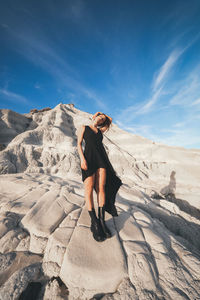 Happy woman enjoying life and freedom outdoor at sunset