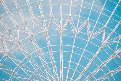 Low angle view of ferris wheel against sky