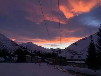 Scenic view of snowcapped mountains against sky at dusk