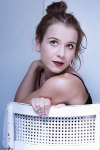 Portrait of beautiful young woman over white background