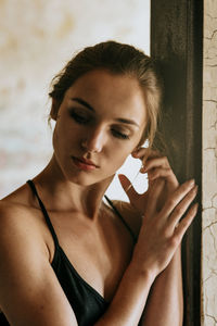 Close-up of young woman at home