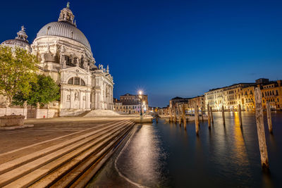 The basilica di santa maria della salute and the canale grande in venice at night