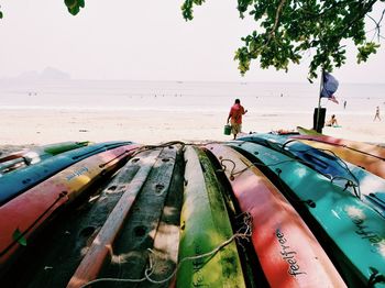 Man standing on beach against sky