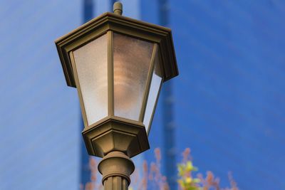 Low angle view of lamp post against sky