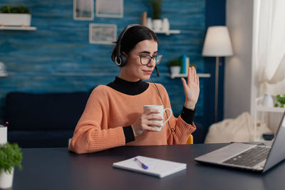 Businesswoman talking on video conference at office