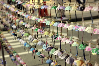 Colorful paper umbrellas hanging on string