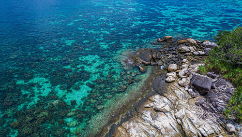 High angle view of rocks in sea
