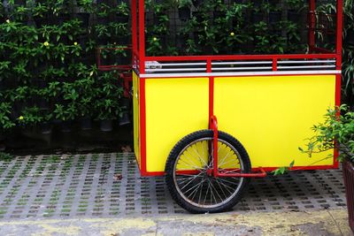 Bicycle against yellow wall