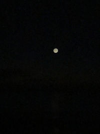 Low angle view of moon against sky at night