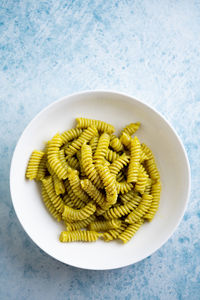 Plate of pasta with pesto genovese, with fresh basil, olive oil, garlic and pine nuts