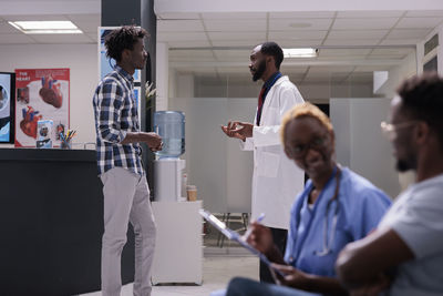 Side view of doctor working in office