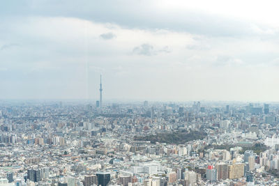 High angle view of city buildings against sky