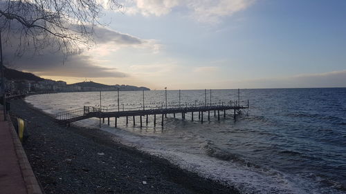 Scenic view of beach against sky during sunset