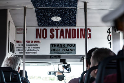 Rear view of people on bus