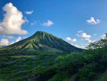 Scenic view of mountain against cloudy sky