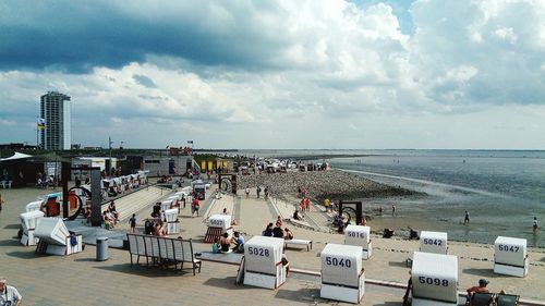 High angle view of people at beach against sky