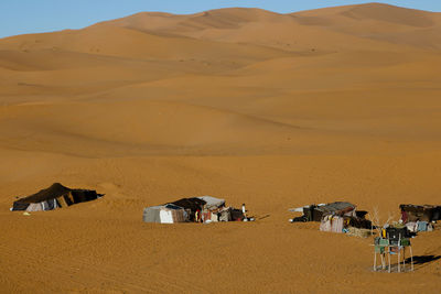 High angle view of houses on sand at desert