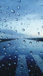 Full frame shot of raindrops on window