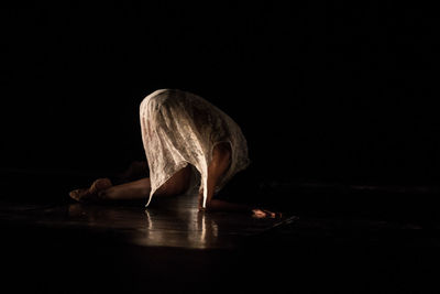 Reflection of ballerina in floor 