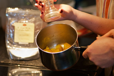 Cropped image of hand holding drink