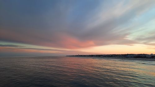 Scenic view of sea against sky at sunset