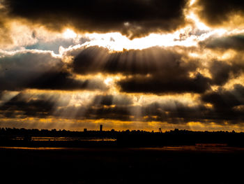 Scenic view of dramatic sky during sunset