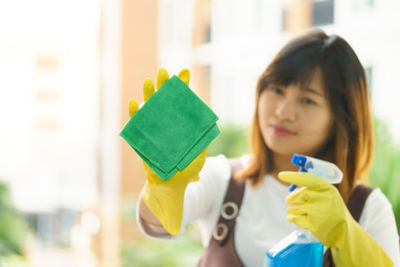 Woman cleaning glass window