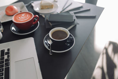 High angle view of coffee cup on table