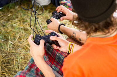 High angle view of man playing guitar