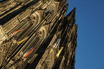 Low angle view of cologne cathedral against clear blue sky