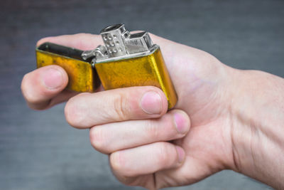 Close-up of hand holding electronic cigarette