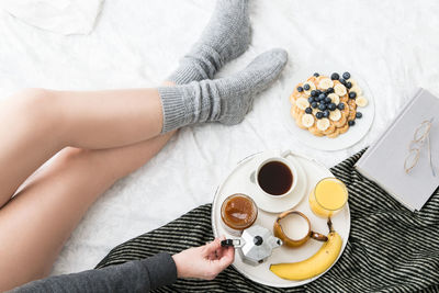 High angle view of woman with coffee cup