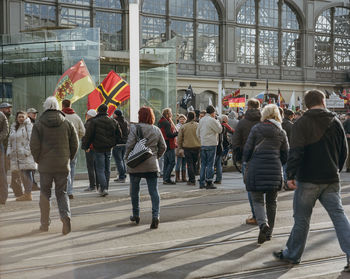 Group of people walking in front of building