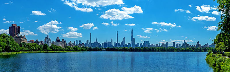 Panoramic view of city and buildings against sky