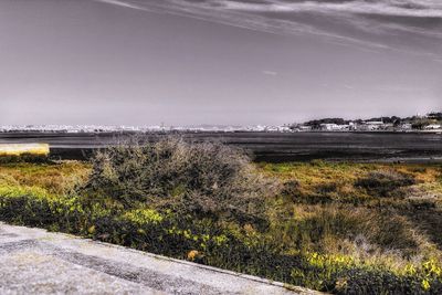 Scenic view of sea and landscape against sky