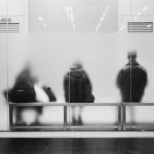 Reflection of people on glass