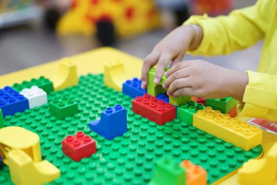Boy playing with toy on table