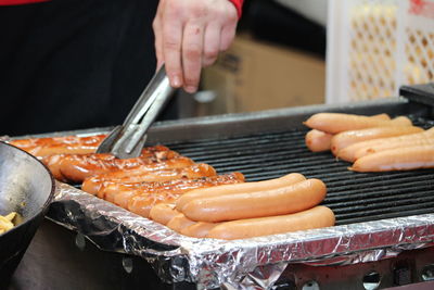 Midsection of man preparing food