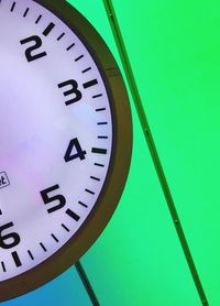 Low angle view of clock on wall