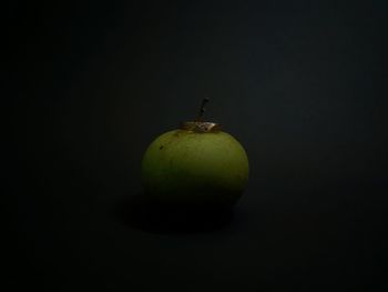 Close-up of apple against black background