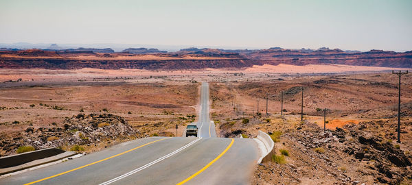 Empty road against clear sky