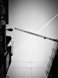 Low angle view of communications tower against clear sky