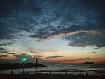 Scenic view of beach against sky during sunset