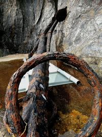 Close-up of rusty metal on rock